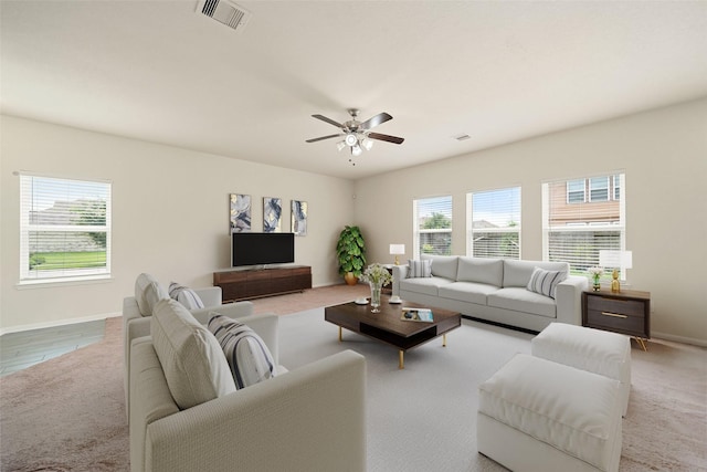 14722 Ruddy Duck Ln, Houston, TX 77049 - carpeted living room with baseboards and ceiling fan