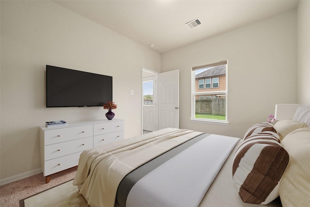14722 Ruddy Duck Ln, Houston, TX 77049 - bedroom featuring light carpet and baseboards