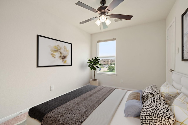 14722 Ruddy Duck Ln, Houston, TX 77049 - bedroom featuring baseboards and ceiling fan