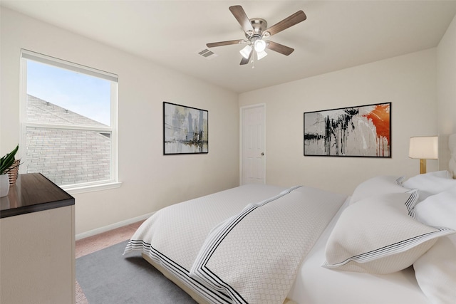 14722 Ruddy Duck Ln, Houston, TX 77049 - carpeted bedroom featuring baseboards and ceiling fan