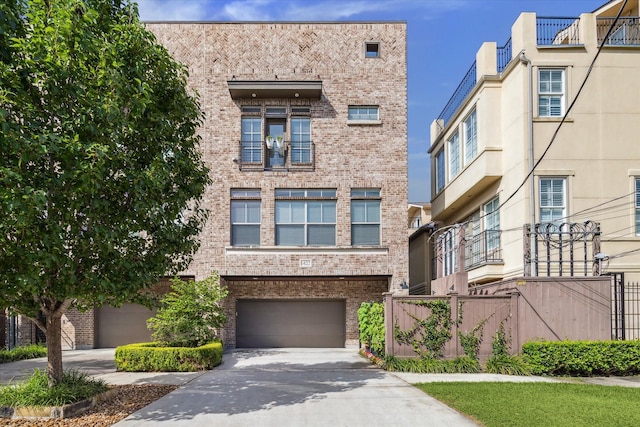 1422 Rosedale St, Houston, TX 77004 - view of front of house featuring brick siding, driveway, and an attached garage