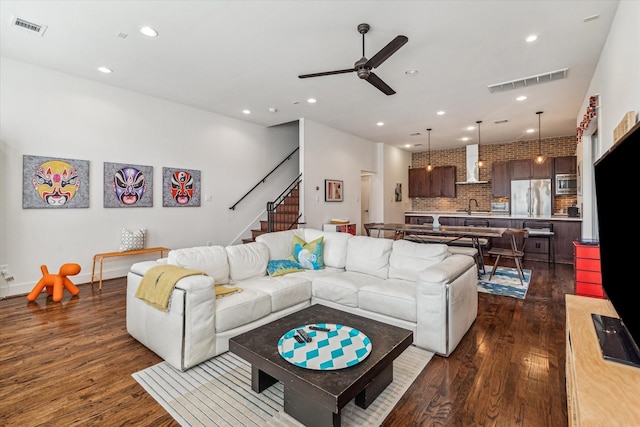 1422 Rosedale St, Houston, TX 77004 - living area with dark wood finished floors, a ceiling fan, stairway, and recessed lighting