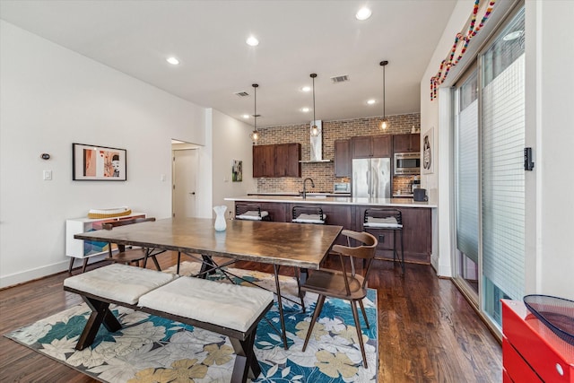 1422 Rosedale St, Houston, TX 77004 - dining space featuring dark wood-style flooring and recessed lighting