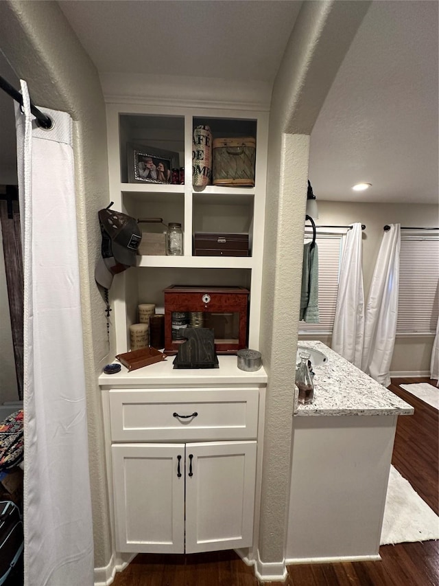 2201 Oleander Dr, Dickinson, TX 77539 - bar area with dark wood-style flooring