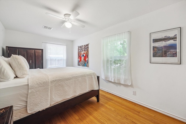 2110 Chippendale Rd, Houston, TX 77018 - bedroom featuring wood finished floors and a ceiling fan