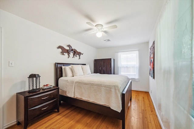 2110 Chippendale Rd, Houston, TX 77018 - bedroom with light wood finished floors and a ceiling fan