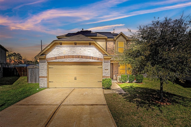 15307 Meandering Post Trl, Houston, TX 77044 - view of front of home with roof mounted solar panels, brick siding, concrete driveway, and an attached garage