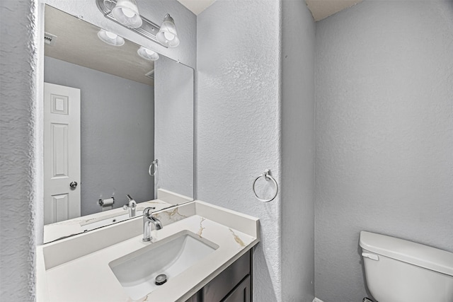 15307 Meandering Post Trl, Houston, TX 77044 - bathroom featuring a textured wall and vanity