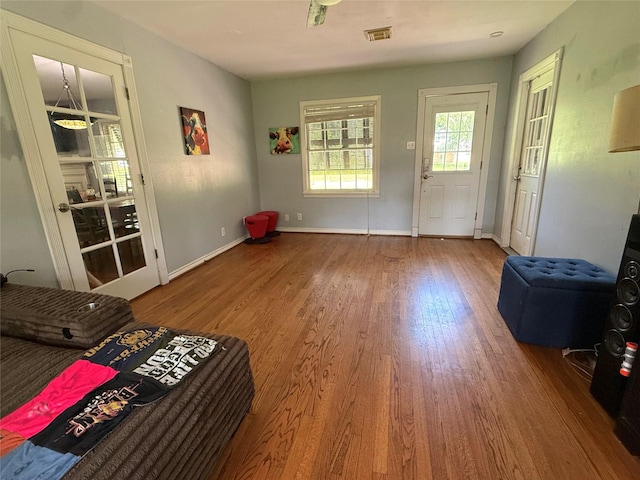 132 Daisy St, Lake Jackson, TX 77566 - doorway to outside with wood finished floors and baseboards
