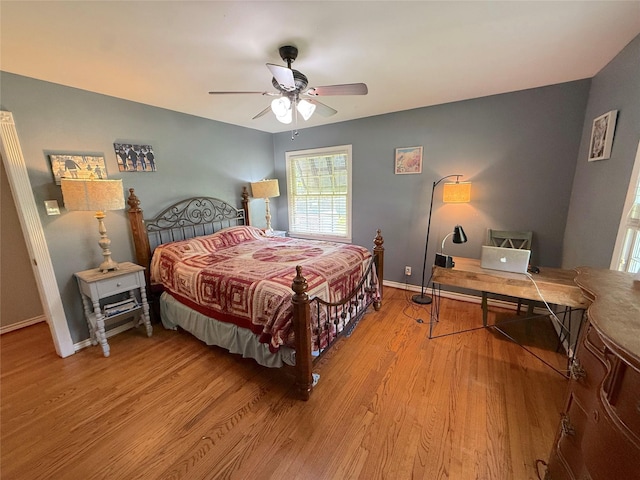 132 Daisy St, Lake Jackson, TX 77566 - bedroom with light wood-style floors, a ceiling fan, and an office area