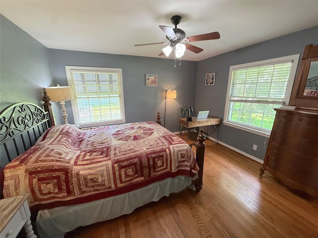 132 Daisy St, Lake Jackson, TX 77566 - bedroom with wood finished floors and ceiling fan