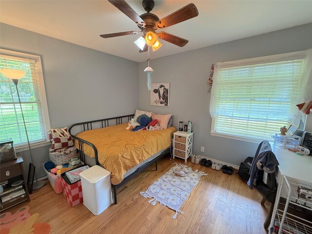 132 Daisy St, Lake Jackson, TX 77566 - bedroom with wood finished floors and a ceiling fan