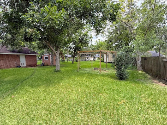 132 Daisy St, Lake Jackson, TX 77566 - view of yard featuring a shed and a pergola