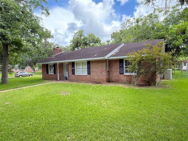 132 Daisy St, Lake Jackson, TX 77566 - ranch-style house featuring a front lawn, a chimney, and brick siding