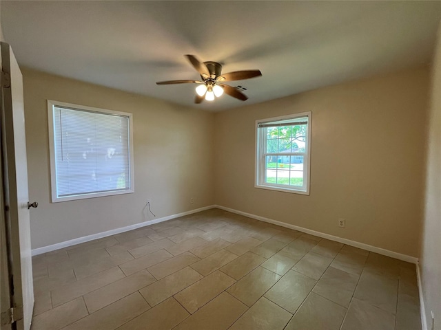 300 Robbie St, La Marque, TX 77568 - empty room with a ceiling fan and tile patterned flooring