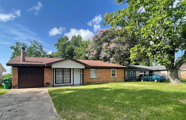 300 Robbie St, La Marque, TX 77568 - single story home with brick siding, a front lawn, concrete driveway, and a chimney