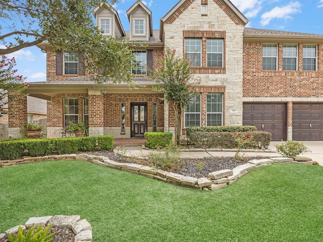 3310 Compass Ct, Conroe, TX 77301 - view of front facade featuring concrete driveway, brick siding, a front lawn, a garage, and stone siding