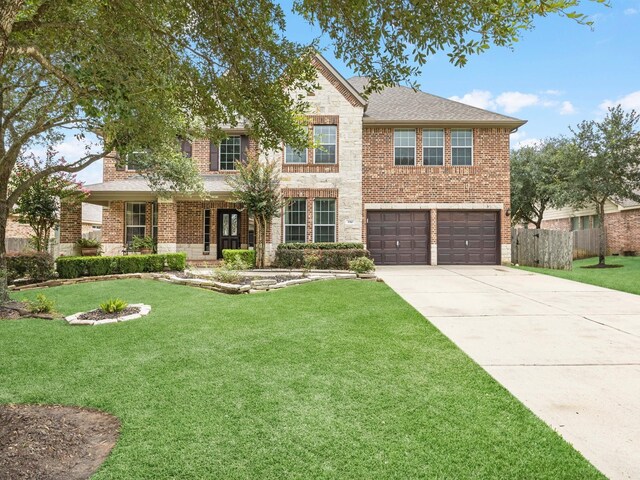 3310 Compass Ct, Conroe, TX 77301 - traditional-style house with concrete driveway, brick siding, a garage, and roof with shingles