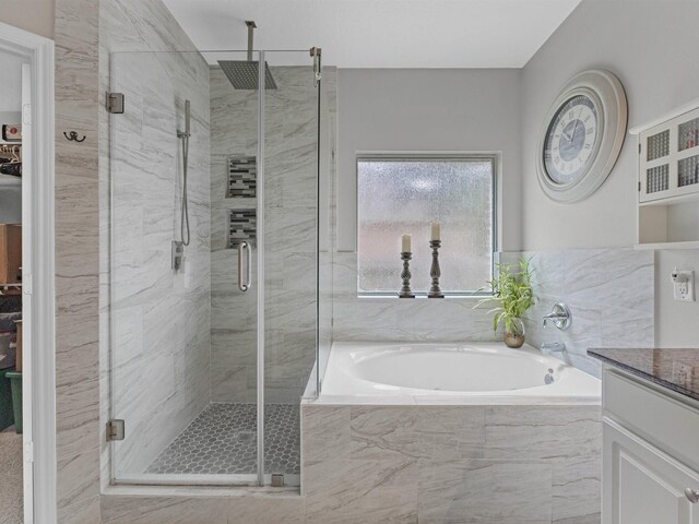3310 Compass Ct, Conroe, TX 77301 - full bathroom featuring a stall shower, a bath, and vanity