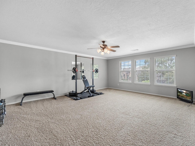 3310 Compass Ct, Conroe, TX 77301 - exercise room featuring crown molding, carpet floors, a textured ceiling, and ceiling fan