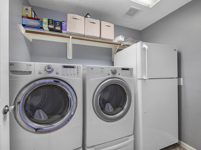 3310 Compass Ct, Conroe, TX 77301 - washroom featuring washer and dryer and baseboards