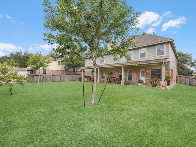3310 Compass Ct, Conroe, TX 77301 - rear view of house featuring brick siding and a fenced backyard