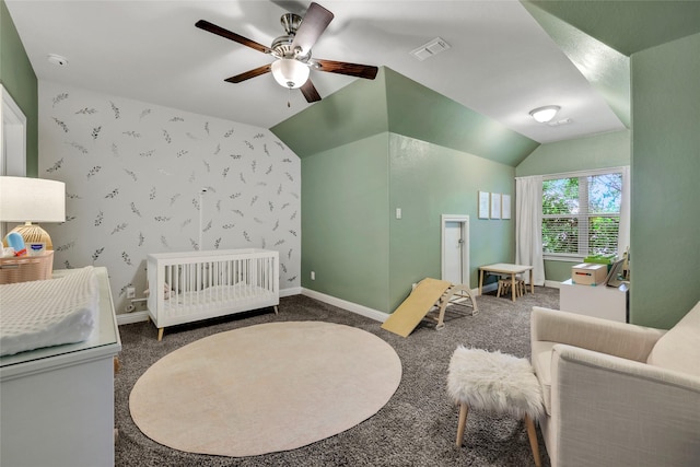 1002 Shepherd Oaks Dr, Houston, TX 77018 - carpeted bedroom with a crib, ceiling fan, vaulted ceiling, and wallpapered walls