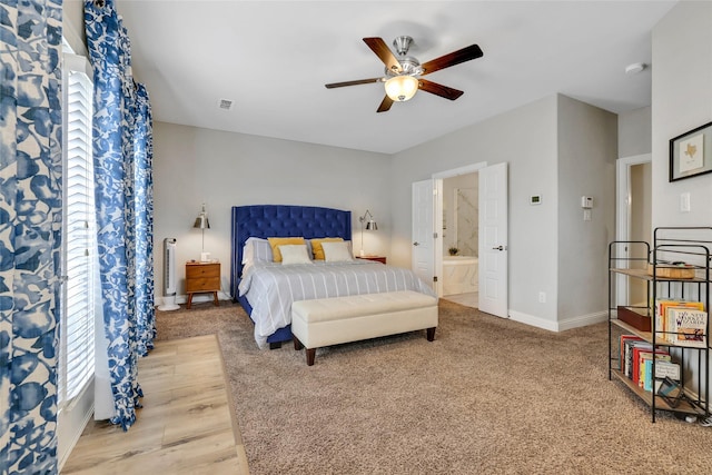 1002 Shepherd Oaks Dr, Houston, TX 77018 - bedroom with light carpet, connected bathroom, and a ceiling fan