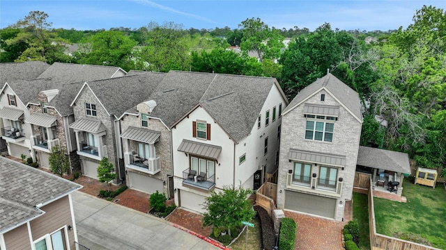 1002 Shepherd Oaks Dr, Houston, TX 77018 - view of front of home with driveway, an attached garage, and roof with shingles