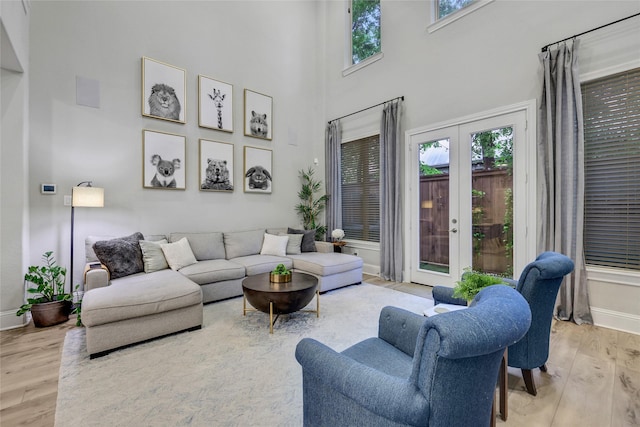 1002 Shepherd Oaks Dr, Houston, TX 77018 - living area featuring wood finished floors, a high ceiling, and french doors