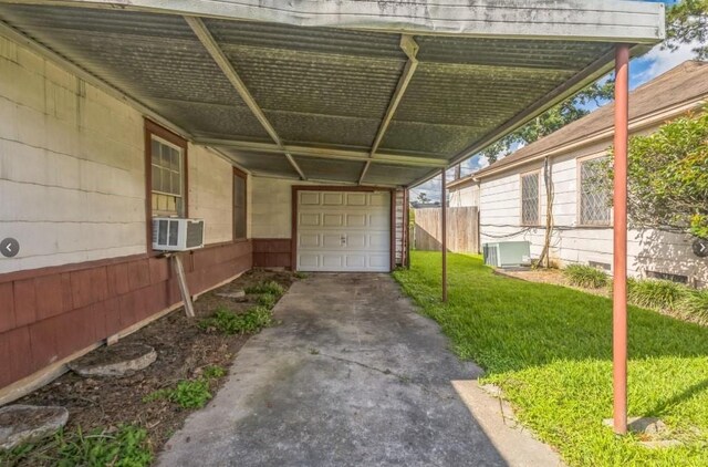 3826 Blodgett St, Houston, TX 77004 - view of patio with cooling unit and a garage