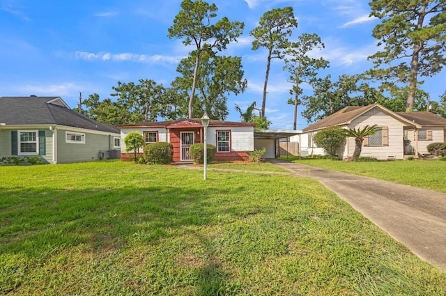 3826 Blodgett St, Houston, TX 77004 - ranch-style home featuring concrete driveway, an attached carport, and a front lawn