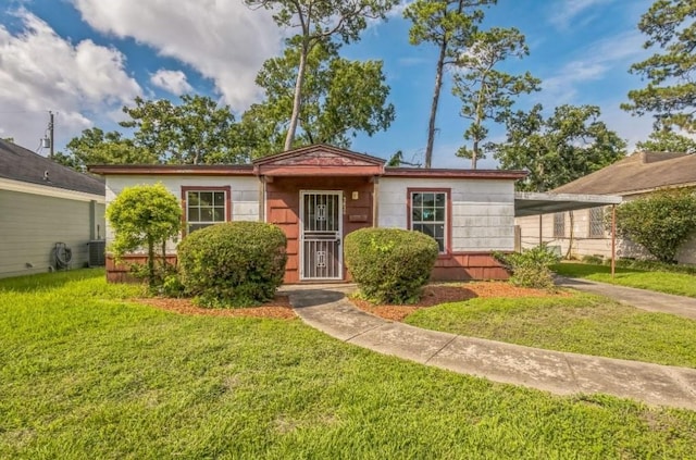 3826 Blodgett St, Houston, TX 77004 - view of front of home featuring a front lawn, an attached carport, and driveway