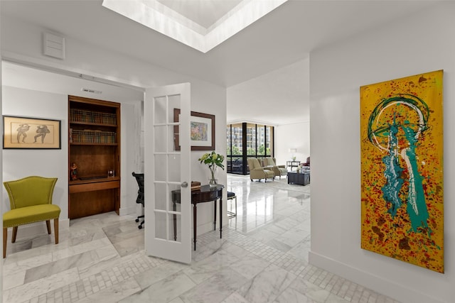 5555 Del Monte Dr Unit T24, Houston, TX 77056 - hall with marble look tiles and a skylight