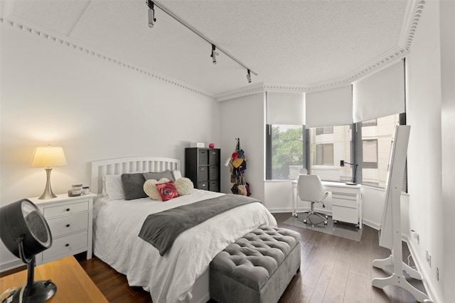 5555 Del Monte Dr Unit T24, Houston, TX 77056 - bedroom with track lighting, dark wood-style flooring, and a desk