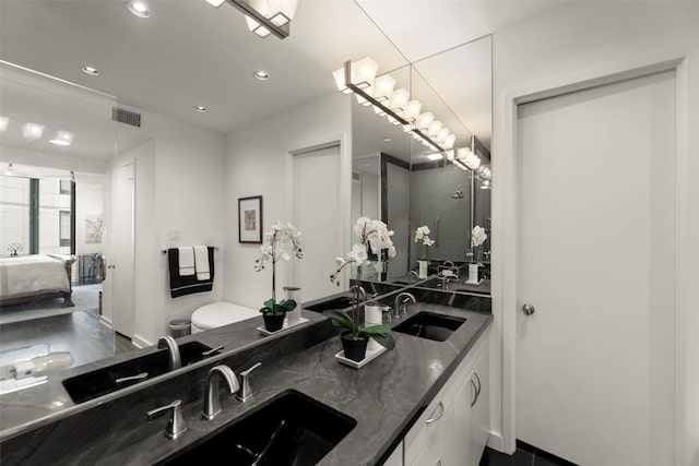 5555 Del Monte Dr Unit T24, Houston, TX 77056 - ensuite bathroom featuring double vanity and recessed lighting
