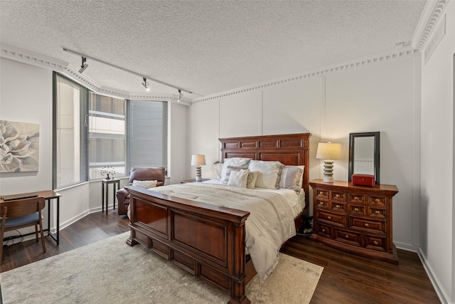 5555 Del Monte Dr Unit T24, Houston, TX 77056 - bedroom featuring track lighting, wood finished floors, and a textured ceiling