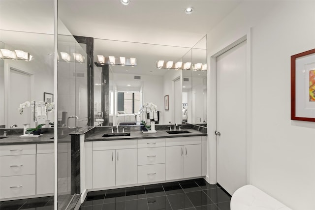 5555 Del Monte Dr Unit T24, Houston, TX 77056 - bathroom with double vanity, a stall shower, tile patterned flooring, and recessed lighting