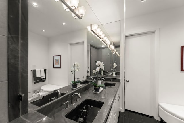 5555 Del Monte Dr Unit T24, Houston, TX 77056 - bathroom featuring double vanity, tile patterned floors, and recessed lighting