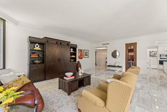 5555 Del Monte Dr Unit T24, Houston, TX 77056 - living area featuring light marble finish floors, a textured ceiling, ornamental molding, and a barn door