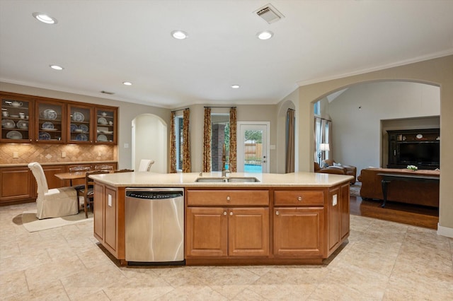 5222 Arcadia Glen Ln, Katy, TX 77494 - kitchen with dishwasher, arched walkways, backsplash, crown molding, and light countertops
