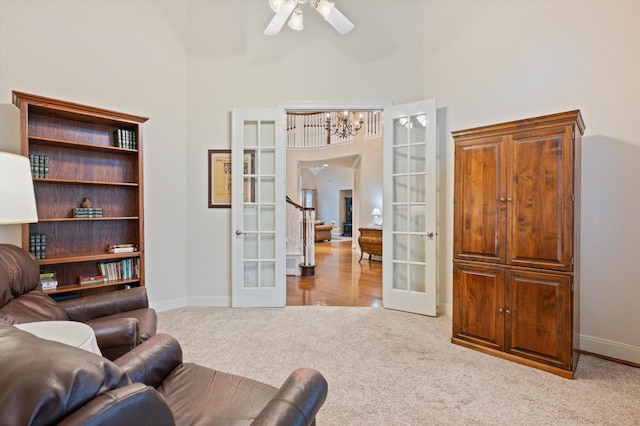 5222 Arcadia Glen Ln, Katy, TX 77494 - living room featuring french doors, a towering ceiling, carpet, and a ceiling fan