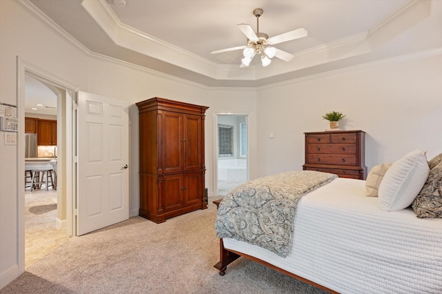 5222 Arcadia Glen Ln, Katy, TX 77494 - bedroom featuring a tray ceiling, crown molding, light carpet, and freestanding refrigerator