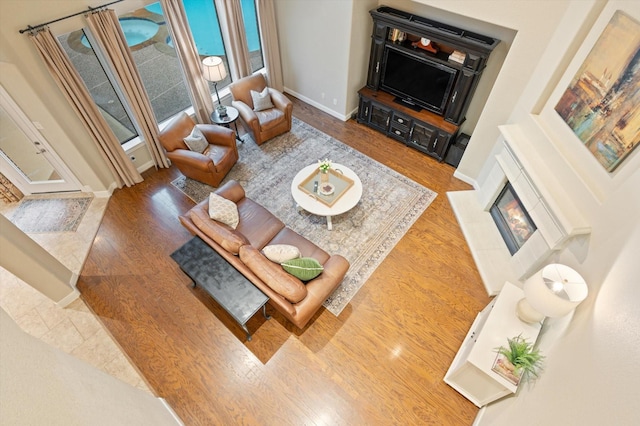 5222 Arcadia Glen Ln, Katy, TX 77494 - living room with wood finished floors and a fireplace