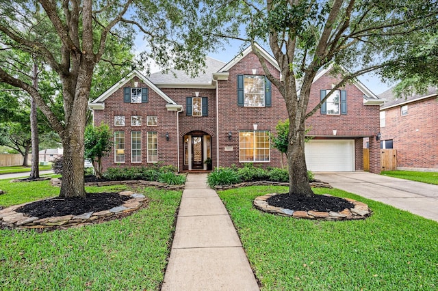 5222 Arcadia Glen Ln, Katy, TX 77494 - traditional home with brick siding, concrete driveway, a front lawn, and an attached garage