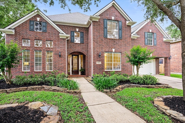 5222 Arcadia Glen Ln, Katy, TX 77494 - view of front facade featuring brick siding, a garage, concrete driveway, and roof with shingles
