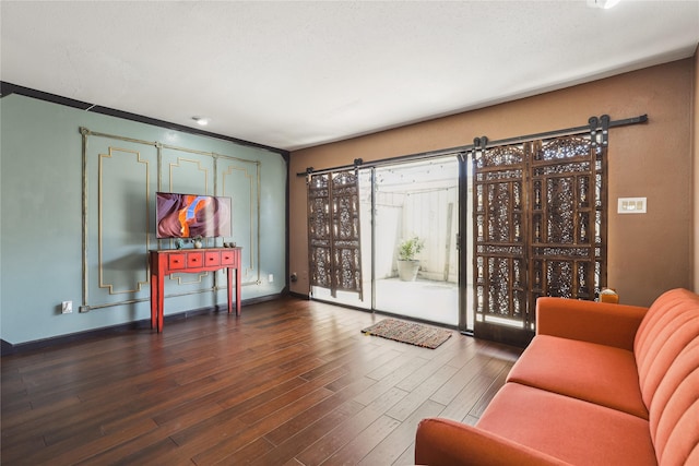 6442 Olympia Dr Unit 85, Houston, TX 77057 - living area with a barn door and dark wood finished floors