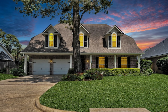 31322 Capella Cir, Tomball, TX 77375 - view of front of home with driveway, a front lawn, brick siding, a porch, and roof with shingles