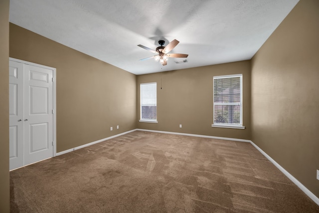 31322 Capella Cir, Tomball, TX 77375 - unfurnished room featuring carpet floors and a ceiling fan