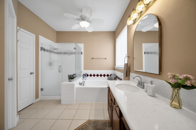 31322 Capella Cir, Tomball, TX 77375 - full bathroom with vanity, a stall shower, a garden tub, tile patterned flooring, and a ceiling fan